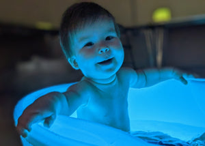 Baby having a splashing time in a whirlpool bath