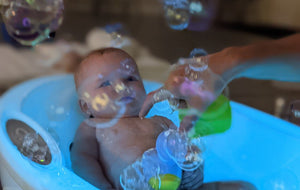 Baby stimulated by bubbles in a spa
