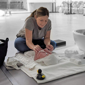 Mum bonding with baby during a massage